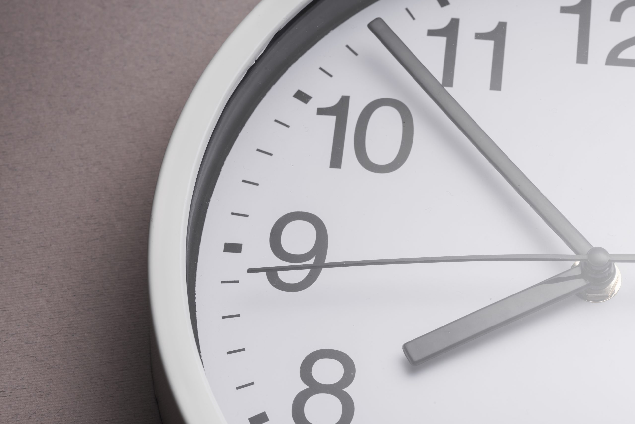 close-up-white-clock-ticking-showing-8-oclock